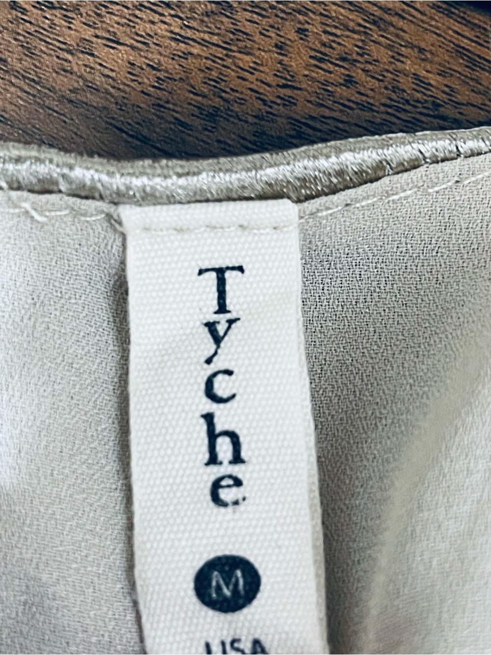 Tyche Cream Labelled Garment with Metallic Trim - Picture 2 of 5